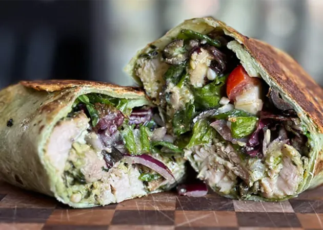 Frazie'S Meat &Amp; Market | Frazie'S Meat &Amp; Market Hand-crafted gourmet wrap filled with grilled chicken, fresh greens, and vibrant vegetables, showcasing Frazie's Meat & Market's commitment to high-quality, locally sourced ingredients.
